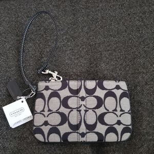 The COACH Signature Collection- wristlet in black